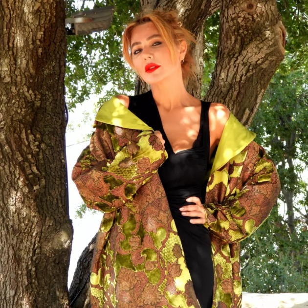 Roula Harb — Olive Brocade Coat, against the olive tree