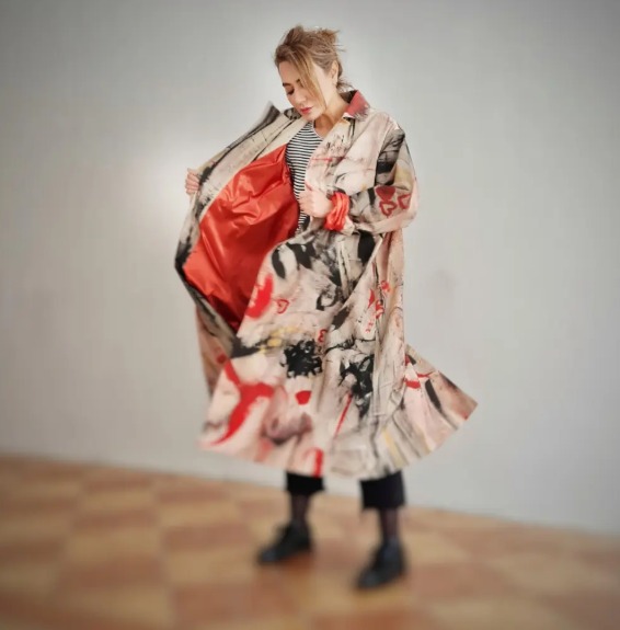 Roula Harb — Abstract coat with red lining, studio