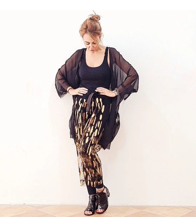 Roula Harb — Black & Gold Pants Ensemble, hands on hips